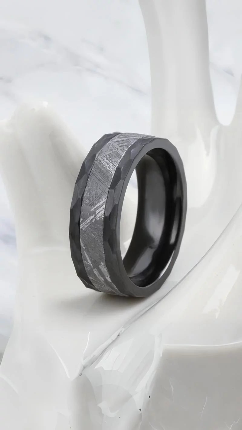 Stunning meteorite ring with black tungsten band, showcasing a genuine Muonionalusta fragment. Unique and stylish meteorite jewelry, combining cosmic beauty with contemporary design, unique meteorite ring