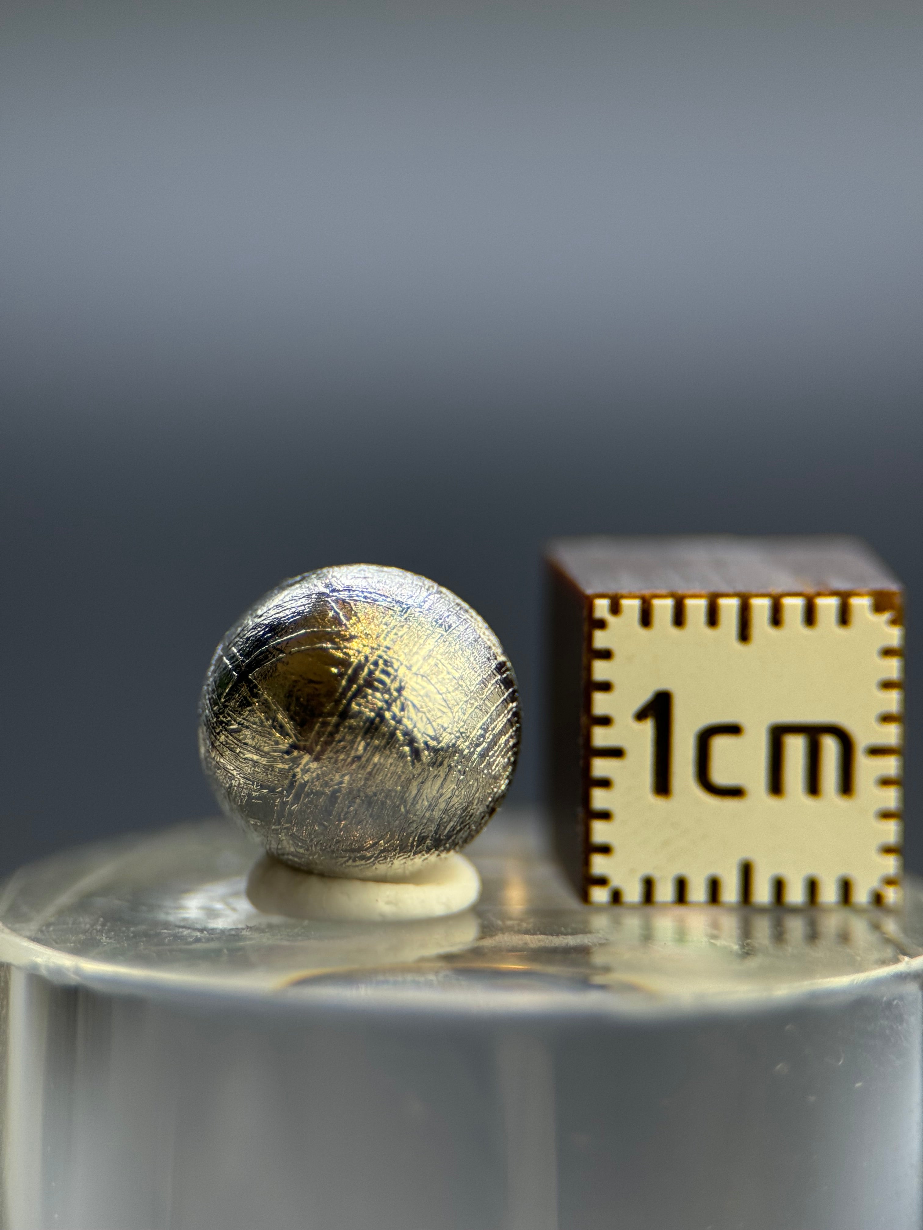 Muonionalusta meteorite, Sweden. 1cm sphere with display.