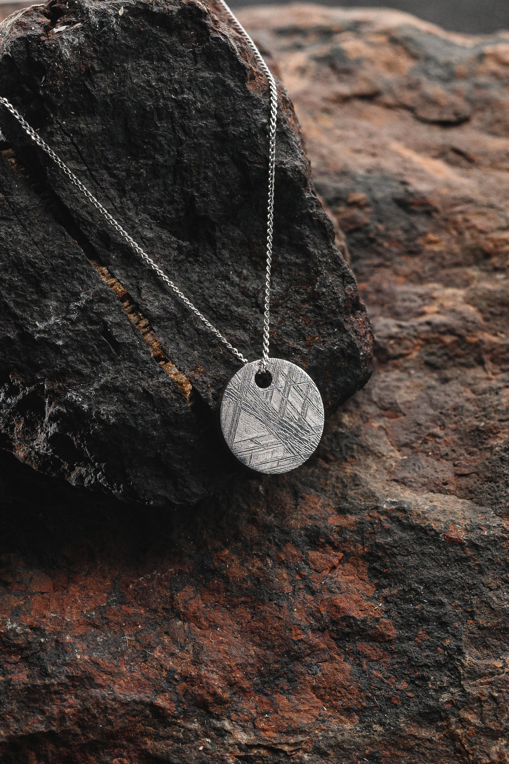 Pendant of solid circle of Muonionalusta meteorite