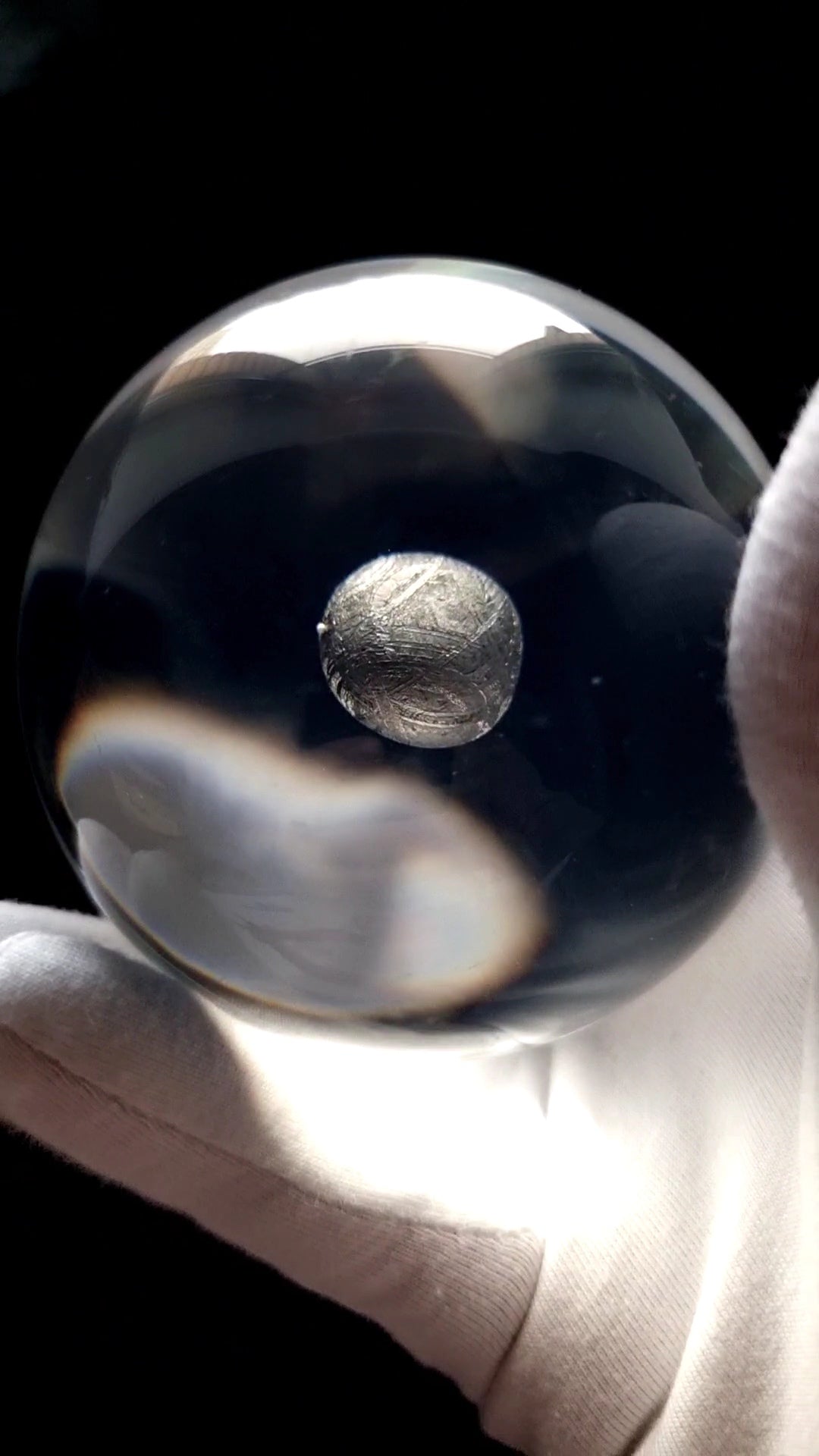 Acrylic sphere with Muonionalusta Meteorite fragment