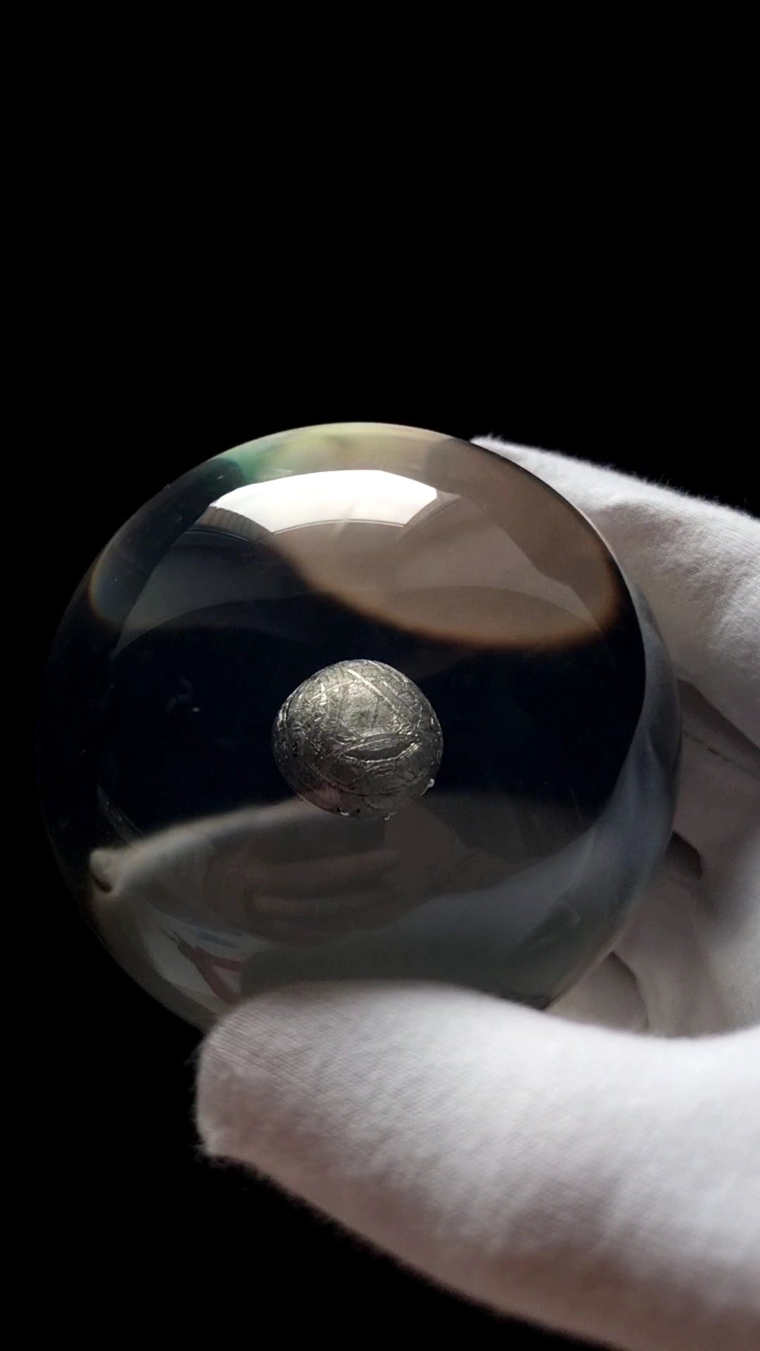 Acrylic sphere with Muonionalusta Meteorite fragment