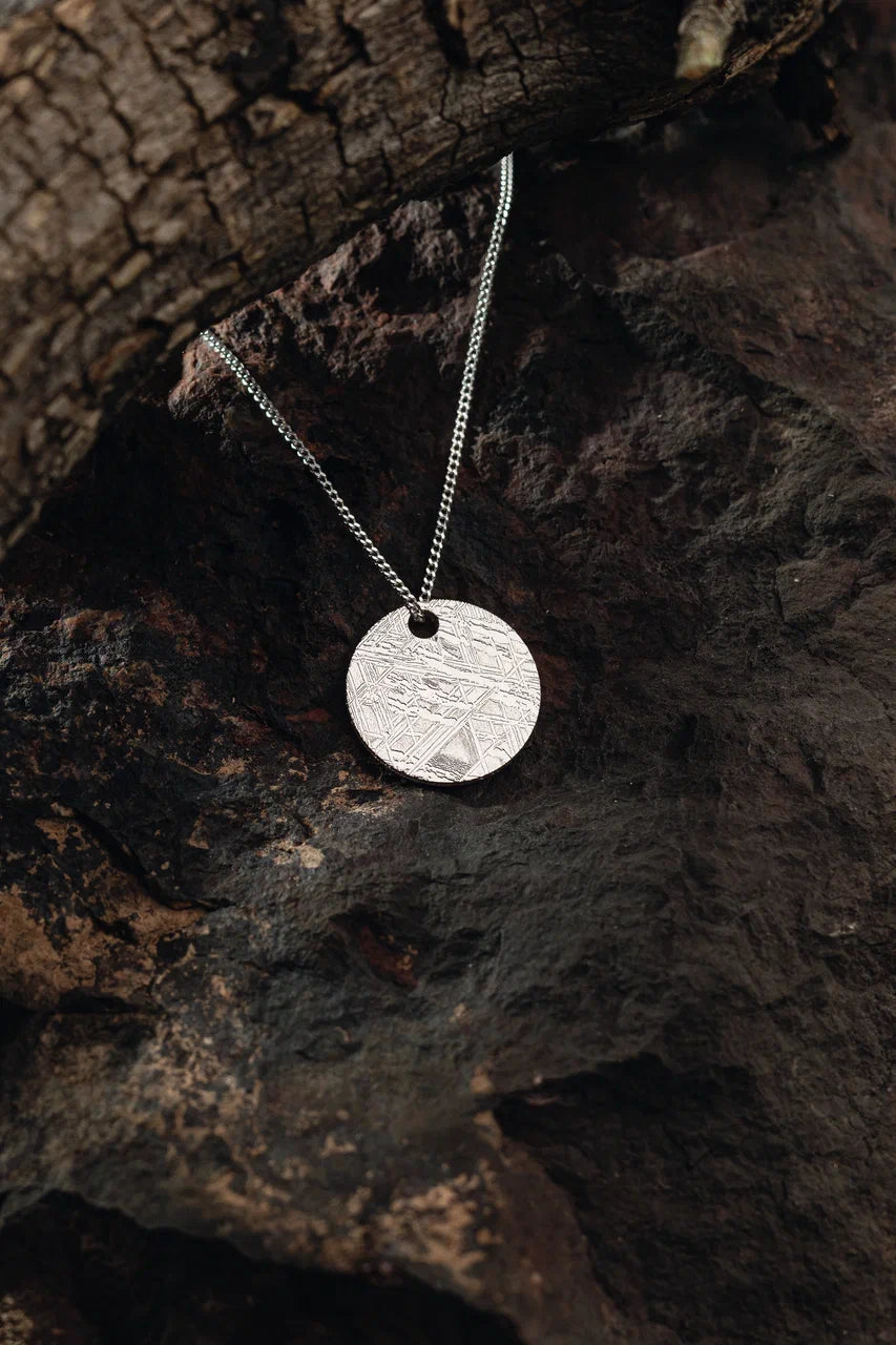 Pendant of solid circle of Muonionalusta meteorite