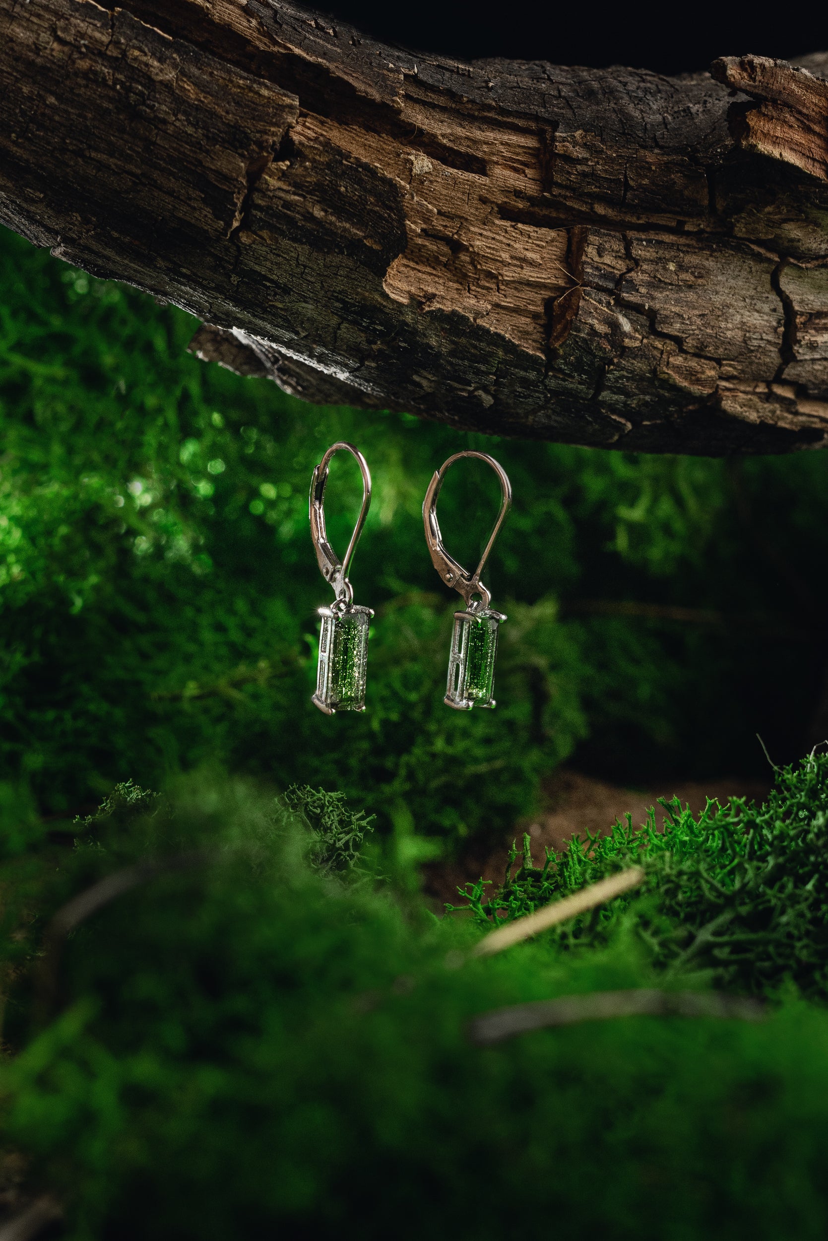 Faceted genuine Moldavite earrings with silver setting - unique celestial jewelry featuring authentic Moldavite. Elevate your style with these exquisite Moldavite earrings
