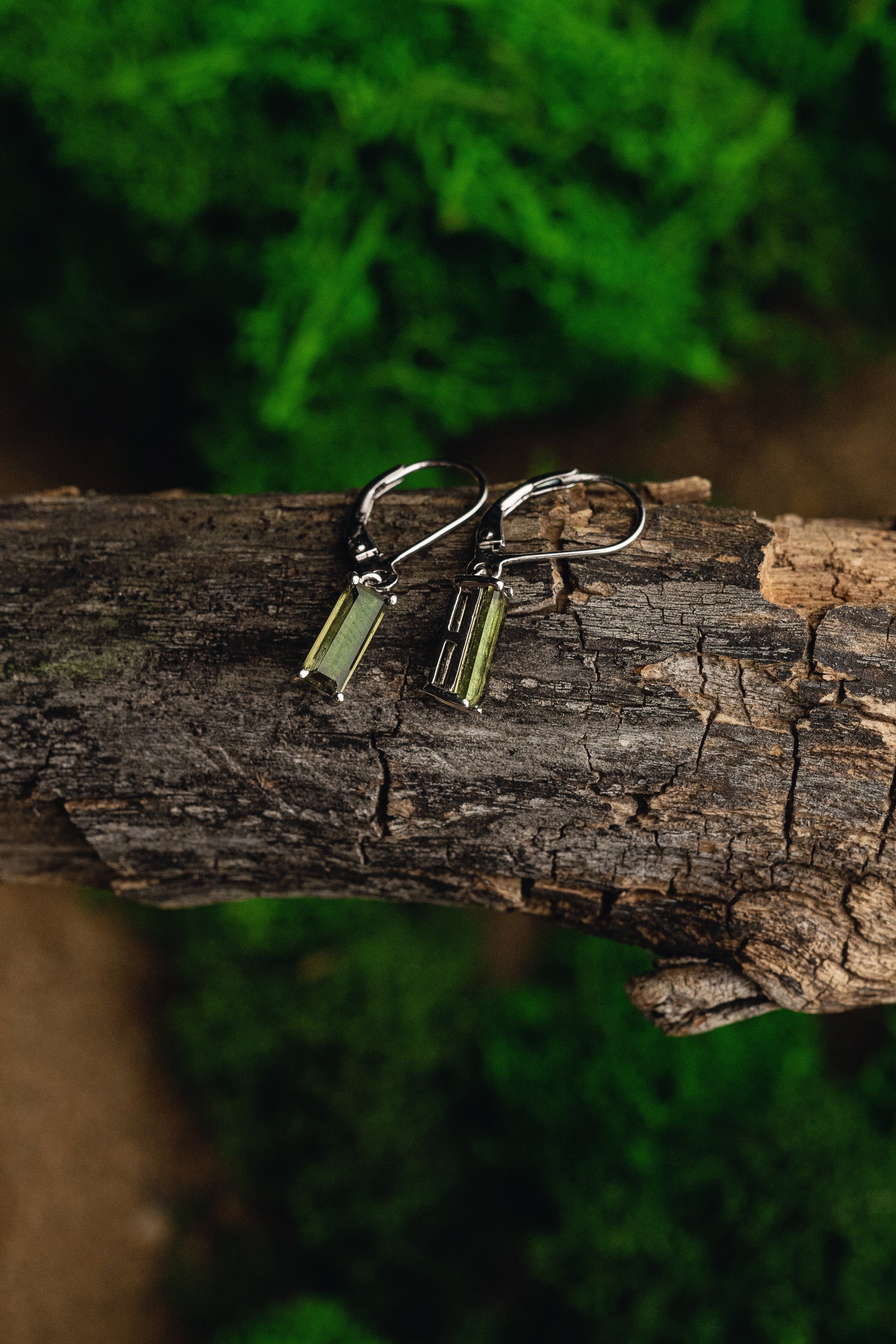 Faceted genuine Moldavite earrings with silver setting - unique celestial jewelry featuring authentic Moldavite. Elevate your style with these exquisite Moldavite earrings