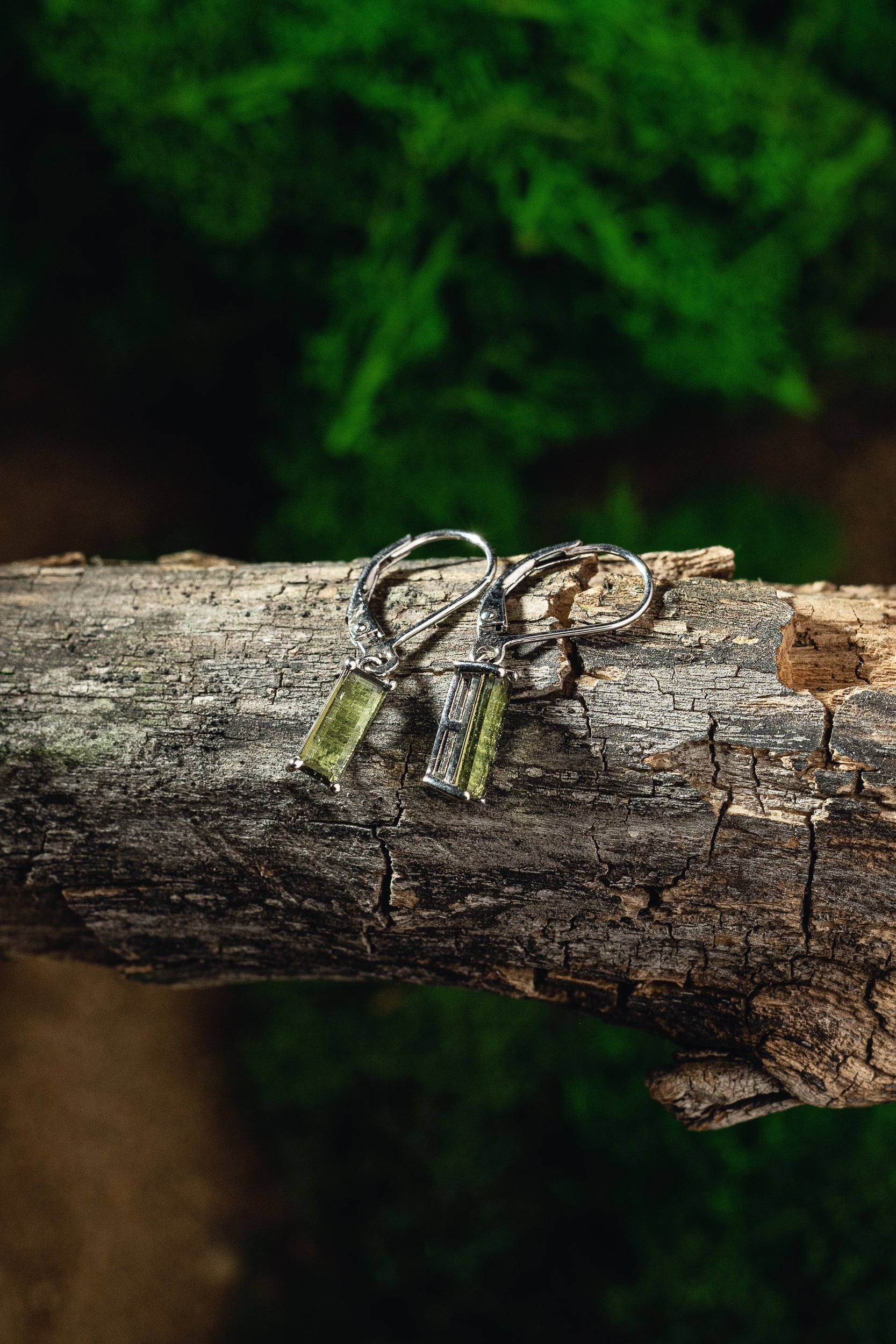 Faceted genuine Moldavite earrings with silver setting - unique celestial jewelry featuring authentic Moldavite. Elevate your style with these exquisite Moldavite earrings