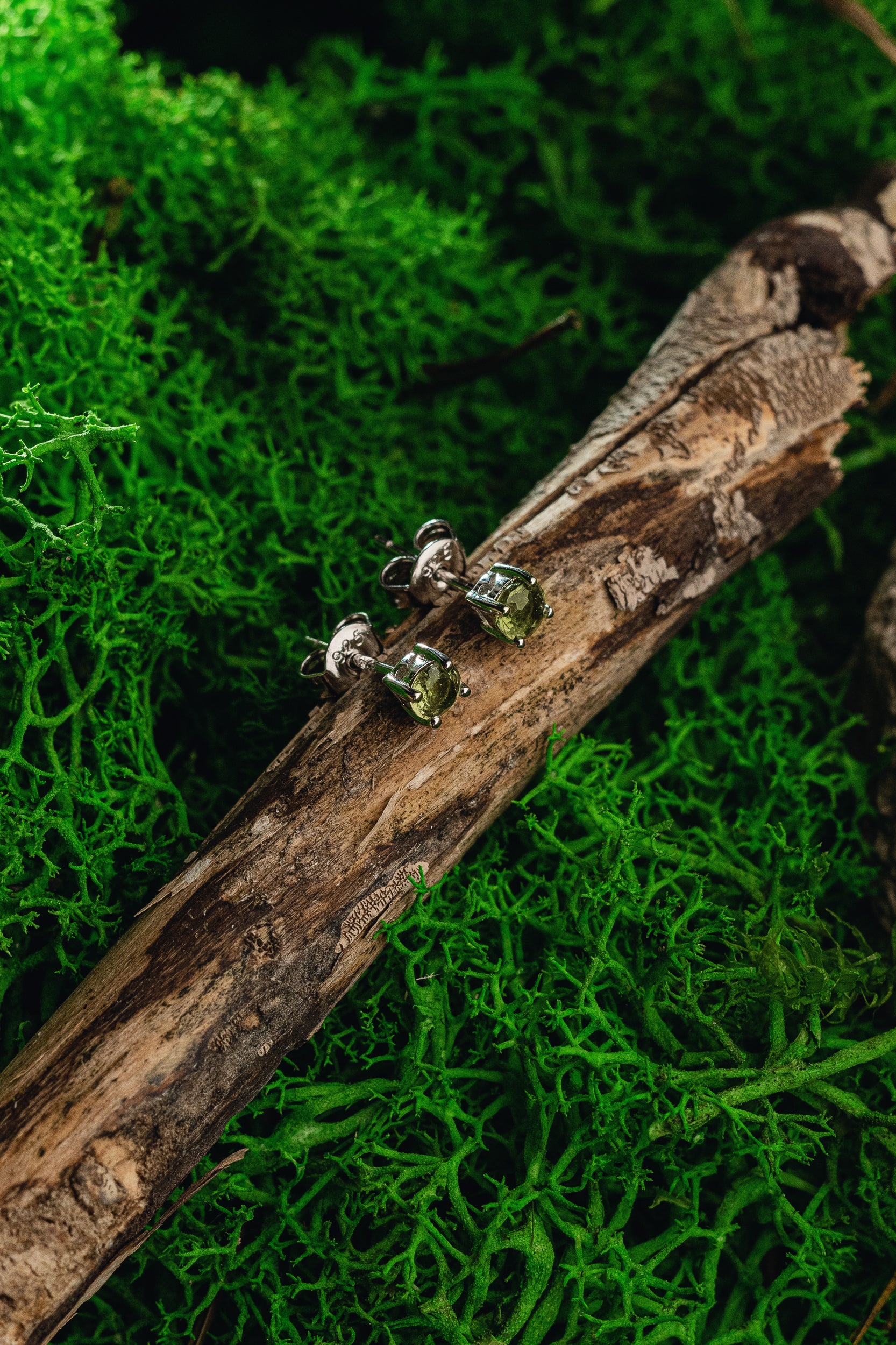 Faceted genuine Moldavite earrings with silver setting - unique celestial jewelry featuring authentic Moldavite. Elevate your style with these exquisite Moldavite earrings