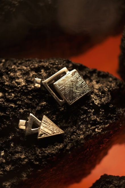 Handcrafted meteorite pendant with silver setting - authentic Muonionalusta meteorite, a celestial style with a genuine meteorite centerpiece. Explore the cosmos with this unique meteorite jewelry piece.