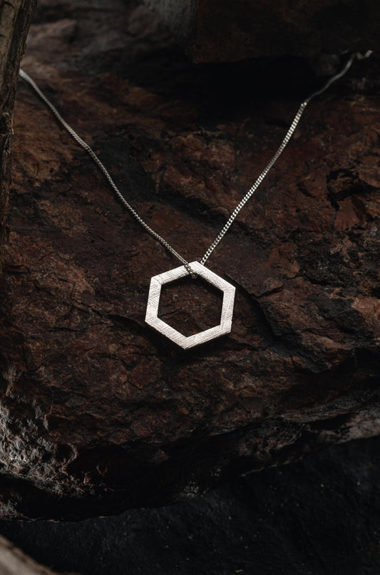 Exagon pendant made with Muonionalusta meteorite, authentic meteorite jewelry. This unique pendant features a beautiful widmanstatten pattern
