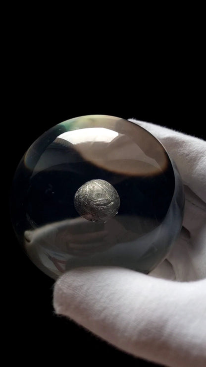 Acrylic sphere with Muonionalusta Meteorite fragment