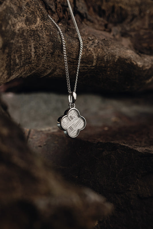 Handcrafted meteorite pendant with silver setting - authentic Muonionalusta meteorite, a celestial style with a genuine meteorite centerpiece. Explore the cosmos with this unique meteorite jewelry piece.