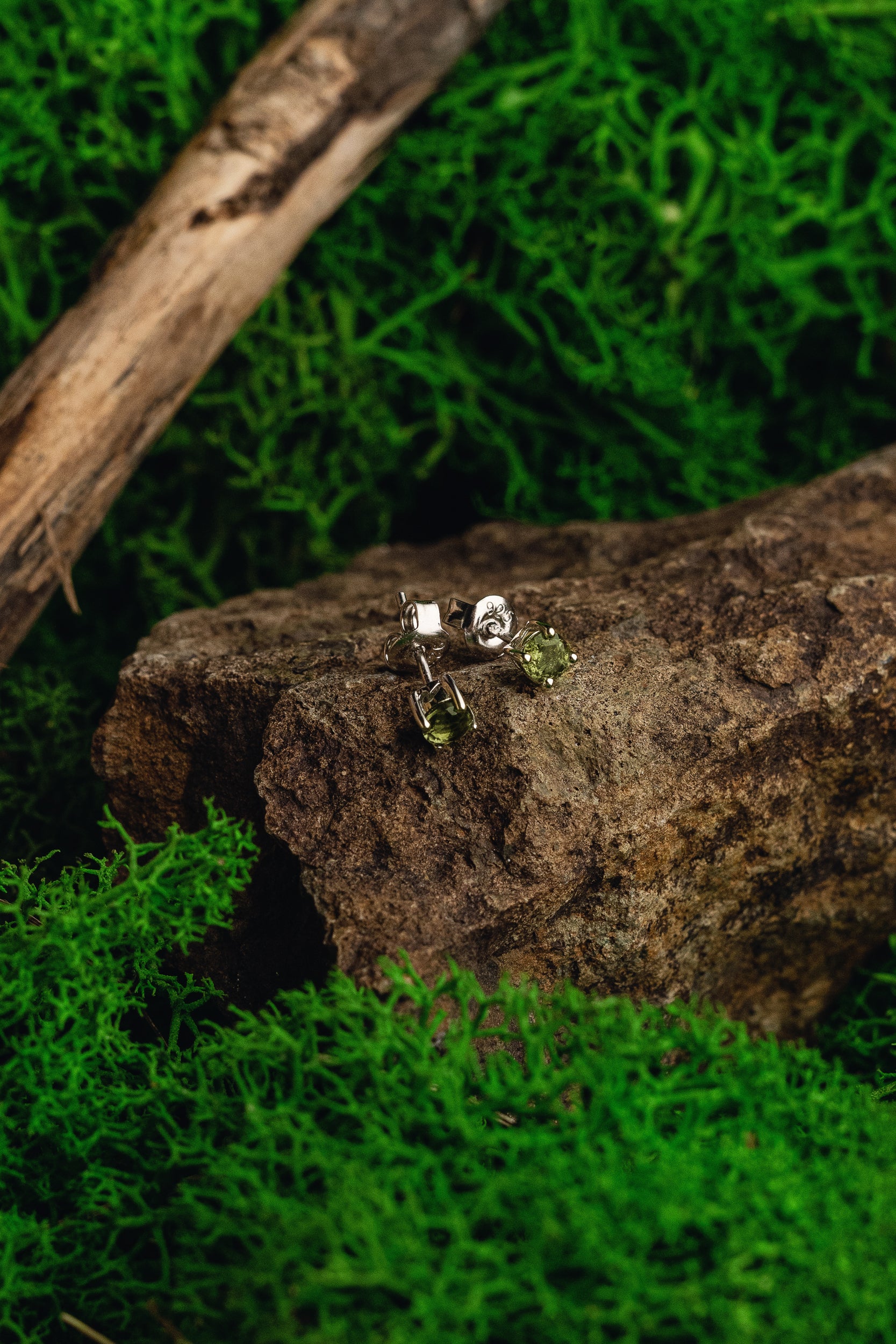 Faceted genuine Moldavite earrings with silver setting - unique celestial jewelry featuring authentic Moldavite. Elevate your style with these exquisite Moldavite earrings