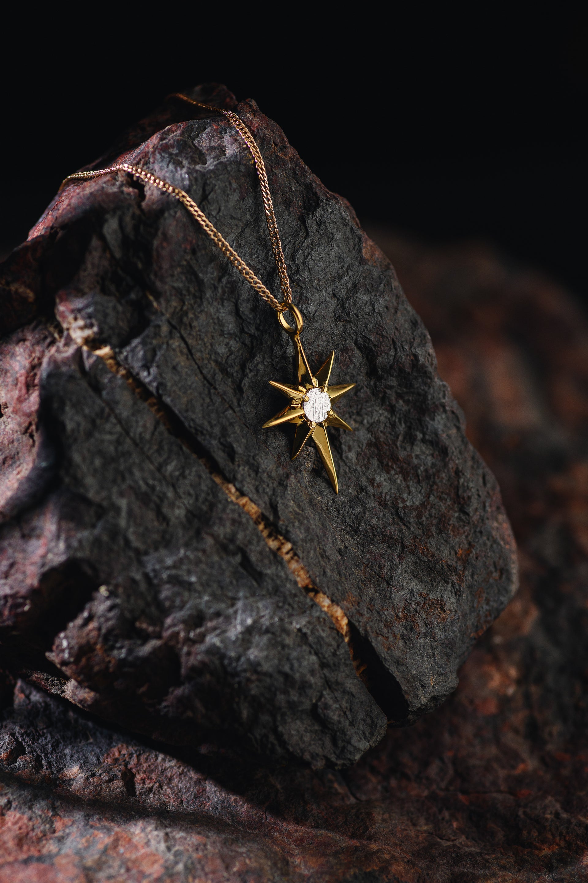 North Star pendant with Muonionalusta meteorite, gold plated.